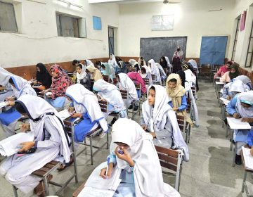 students giving matric exams in class room