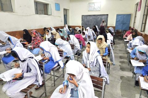 students giving matric exams in class room